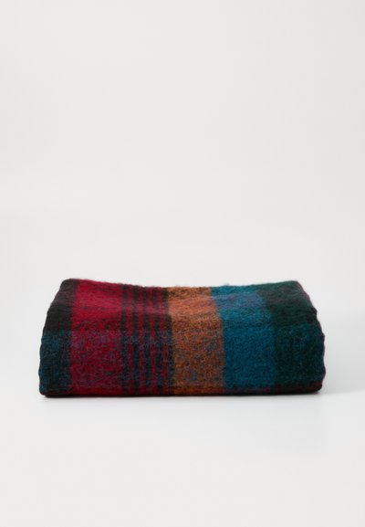 Wool blanket in a folded position, featuring a striped pattern in red, black, teal, and brown, showcasing a soft, textured surface.