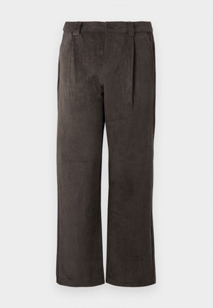 Corduroy pants in a dark brown color, featuring a straight cut, pleats at the front, and side pockets. Texture is ribbed and soft.