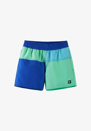 Short de bain enfant avec taille élastique, présentant des blocs de couleur bleu, sarcelle et turquoise, avec un petit patch logo sur la jambe.