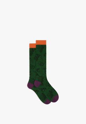 Green socks with a grapevine pattern, orange ribbed cuffs, and purple toe and heel accents. Made from soft, stretchy fabric.