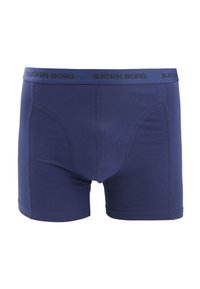 Marineblauwe boxershorts van gladde, rekbare stof met een elastische tailleband waarop "BJÖRN BORG" in het zwart gedrukt staat.