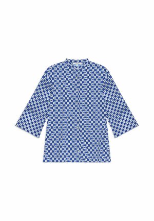 Blouse bleue et blanche à manches longues avec motif géométrique en losanges et boutons à l'avant, présentée à plat sur fond blanc.