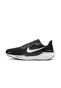 Chaussure de course noire avec une tige en mesh, swoosh Nike blanc, col rembourré et coussin d'air dans la semelle. Dispose d'une semelle extérieure en caoutchouc texturé.