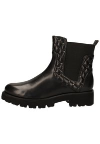 Botte de cheville en cuir noir avec un panneau latéral élastique matelassé et des clous décoratifs. Elle présente une semelle en caoutchouc épaisse et un design à bout arrondi.