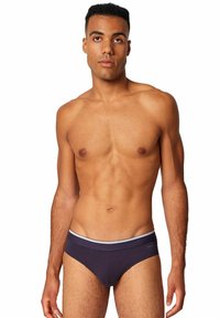 Culotte in cotone blu navy con elastico bianco in vita. Presenta un taglio classico e una consistenza liscia e morbida. Nessun motivo o accento visibile.