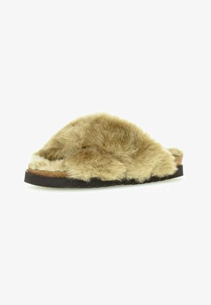 Furry beige slide sandal with a wide, soft upper and a cork footbed. Features a textured rubber sole for grip.