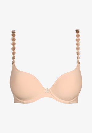 Reggiseno imbottito beige con spalline regolabili, caratterizzato da accenti circolari texturizzati; chiusura centrale decorata con un design texturizzato abbinato.