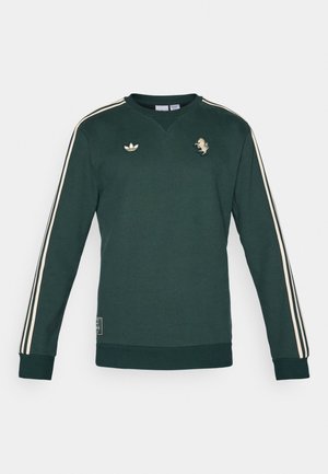 Grøn sweatshirt med lange ærmer, cremefarvede striber på skuldrene, broderet logo og tekstureret stof. Har ribbede manchetter og kant.