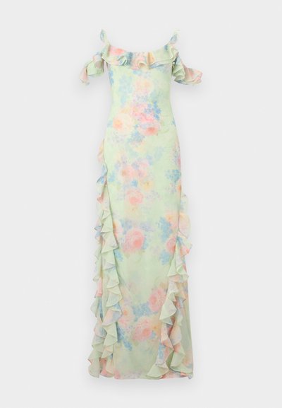 Μακρύ φόρεμα σε παστέλ αποχρώσεις με λουλουδένιο σχέδιο, βολάν που πέφτουν από τους ώμους και κατεβαίνοντας κατά μήκος των πλευρών και των μανικιών.