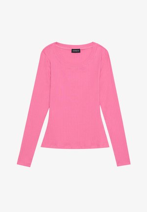 Pikad varrukad, soonikkoes särgid erkroosas värvitoonis, millel on lai ümar kaelus ja sobiv siluett. Kangas on sile, millel on peen struktuur.