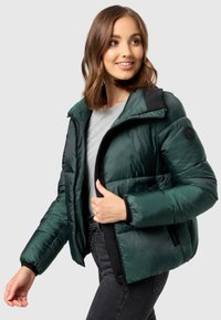 Green puffer jacket with a zipper, black accents on the collar and cuffs, and a textured finish. Features a logo on the sleeve.