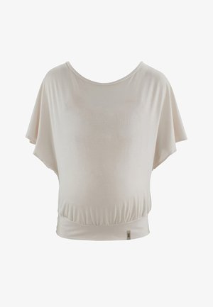 Haut court beige clair à manches courtes, fabriqué en tissu doux et extensible. Coupe décontractée avec un ourlet élastique froncé et un col rond.