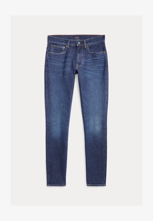 Tamsiai mėlynos siauro silueto džinsinės kelnės su klasikinės penkių kišenių dizainu ir sagos užsegimu, išdėliotos ant balto fono.