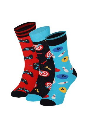 Three colorful socks featuring gaming controllers, archery targets with arrows, and bowling pins with balls on red, black, and blue backgrounds.