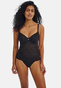 Black lace tankini with a geometric pattern, underwire support, adjustable straps, and a small decorative gold accent at the center.