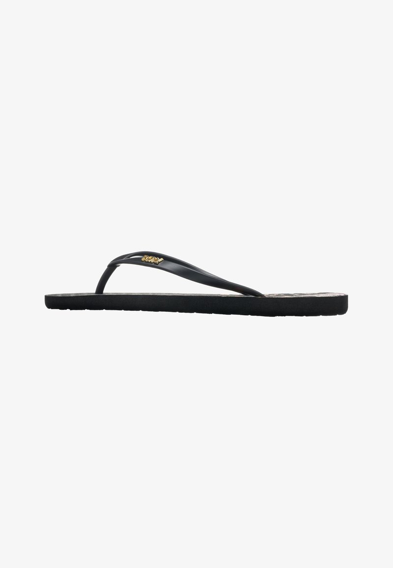 Black flip-flop with a textured sole, thin straps, and a small gold logo. Lightweight design with minimalist style and a flat profile.