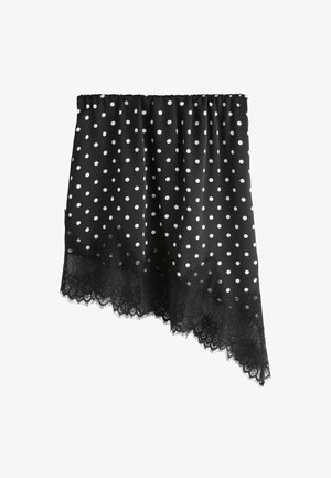 Melna auduma svārki ar baltu punktiņu rakstu, ar viļņotu mežģīņu apakšu. Augšpusē elastīga josta, teksturēta mežģīņu detaļa gar apmali.