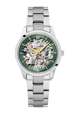 Zilverkleurig metalen polshorloge met groene wijzerplaat, gouden uurmarkeringen en wijzers, en zichtbare mechanische tandwielen binnen de wijzerplaat.