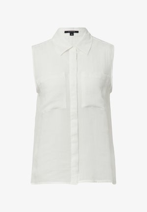 Biała bezrękawnik z kołnierzykiem, dwoma przednimi kieszeniami i listwą guzikową; wykonana z lekkiego materiału o gładkiej teksturze.