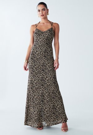 Leopard print maxi dress with thin straps, v-neckline, fitted bodice, and flowing skirt. Made from lightweight, textured fabric.