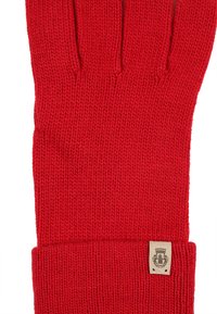 Rote strickhandschuh mit vier Fingern und geripptem Handgelenk. Verfügt über ein kleines Markenetikett am Saum. Weiche Textur und glatte Oberfläche.