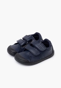 Navy leather children's shoes with dual Velcro straps, textured black rubber sole, and perforated detailing on the sides.