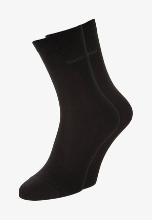 Schwarze Baumwollmischsocken. Sie verfügen über ein geripptes Bündchen, eine glatte Textur und dezentem Branding an der Seite, entworfen für Komfort und Langlebigkeit.