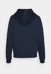 Felpa blu navy con tasca a marsupio, maniche e orlo a coste. Realizzata in morbido tessuto testurizzato con cappuccio completo. Visualizzazione posteriore.