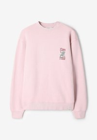 Sweat-shirt rose clair à col rond avec poignets et ourlet côtelés, présentant un petit graphisme d'une personne se relaxant avec une boisson et le texte « Copa Costa » sur la poitrine.