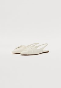 White pointed slingback flats feature a twisted pleat design on the toe, made of smooth leather with a flat sole and minimalistic accents.