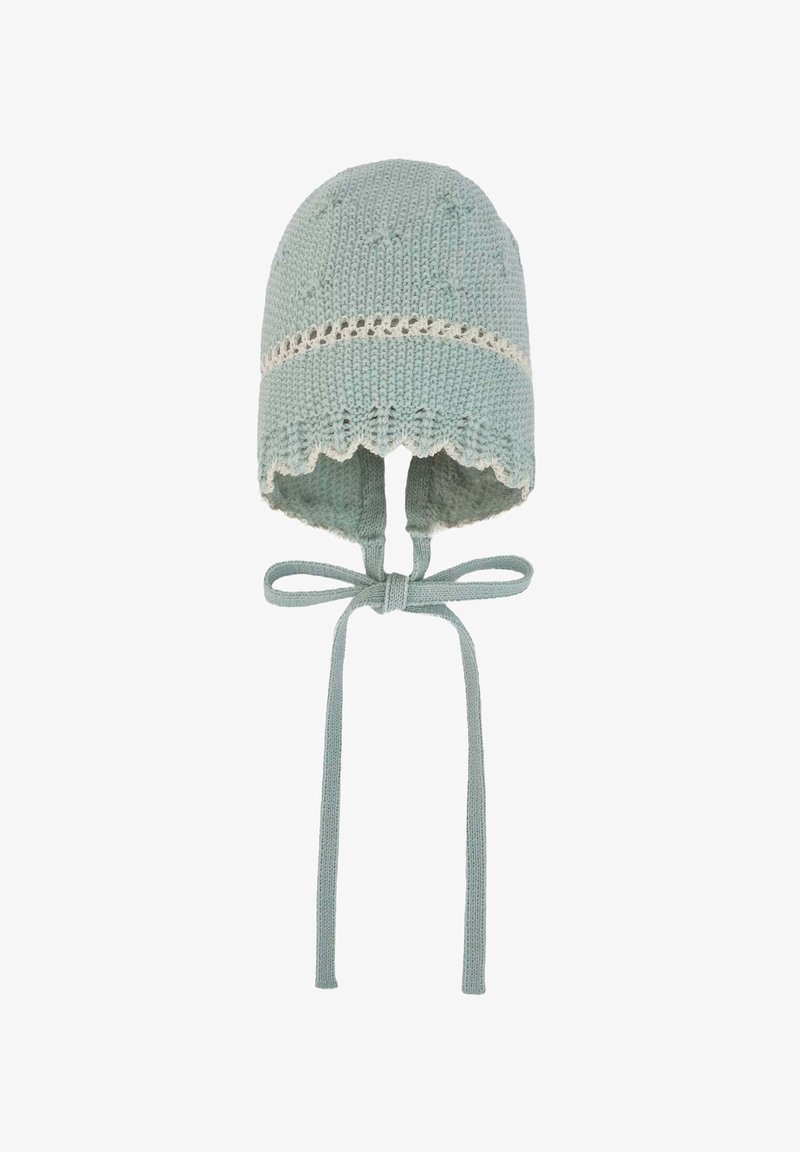 Bonnet pour bébé tricoté en vert menthe avec un bord festonné, présentant une bande blanche, des liens sous le menton et un tissu doux et texturé.