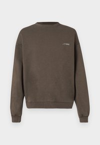 Brown crewneck sweatshirt made from soft fabric, features ribbed cuffs and hem, with a small white logo on the chest.
