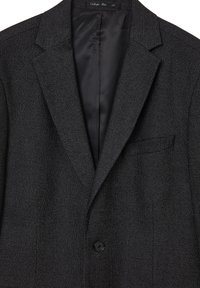 Männer schwarzer Blazer aus strukturiertem Stoff. Mit Reverskragen, einreihigem Knopfverschluss und Brusttasche. Innen glatt.