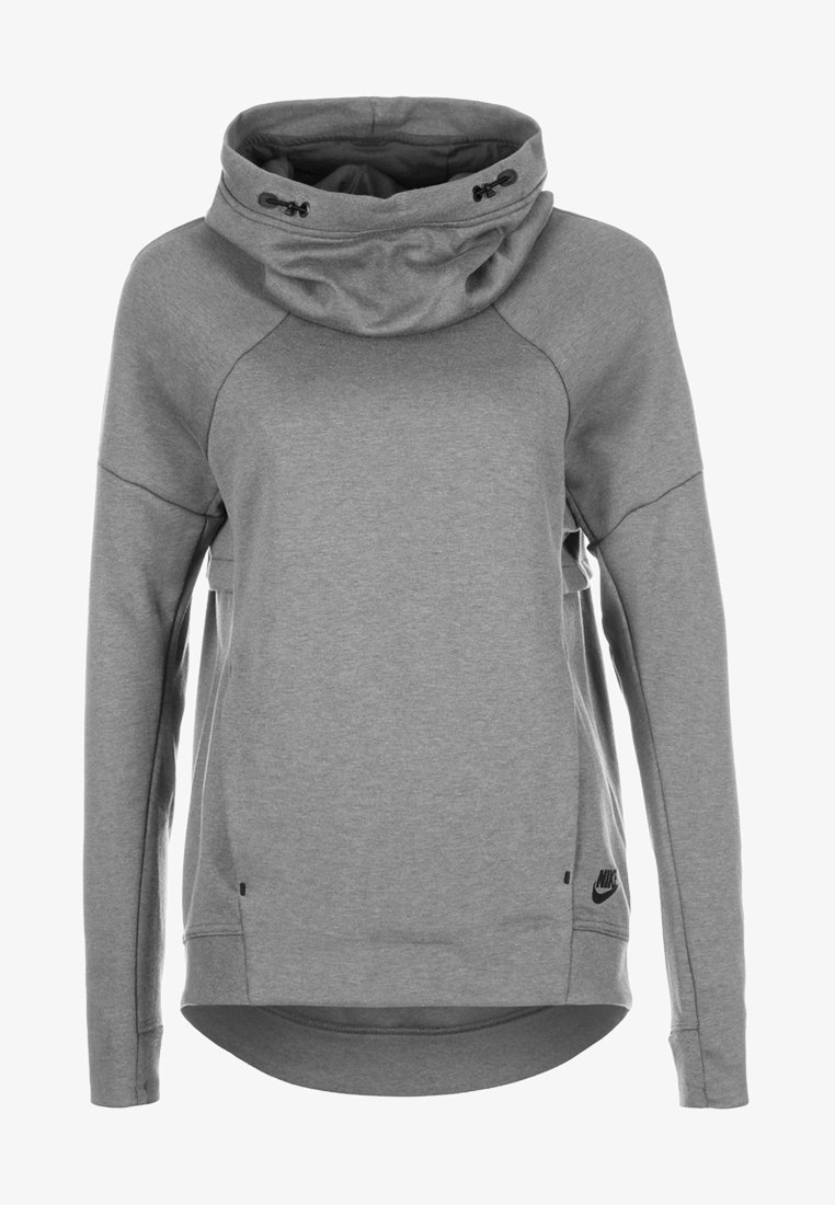 Harmaa Nike-huppari korkealla kauluksella, raglan-hiekoilla ja sivurei'illä. Valmistettu pehmeästä materiaalista, jossa on huomaamaton musta logo helman kohdalla.