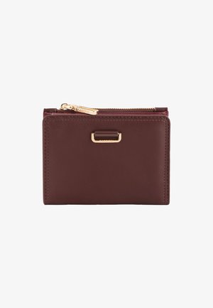 Burgundy leather wallet with a smooth texture, zip closure, and a gold-tone hardware accent. Features a rectangular shape and minimalist design.