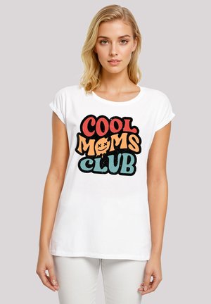 White cotton t-shirt with short sleeves featuring multicolored text "COOL MOMS CLUB" in a playful design. Smooth texture, casual fit.