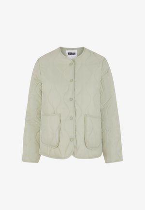 Šviesiai žalias siuvinėtas švarkas su apvaliu iškirpimu, užsegamas snapeliu, ir dviem priekinėmis kišenėmis. Iš viso paviršiaus tęsiasi tekstūrinis banginis raštas.