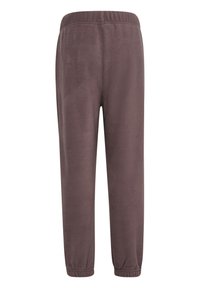 Fleece-Sweatpants in Dunkelbraun mit einem elastischen Bund und schmal zulaufenden Beinenden. Weicher Stoff ohne Taschen oder zusätzliche Details.