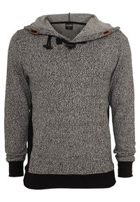 Szürke kötött kapucnis pulóver, texturált mintával, húzózsinórral ellátott kapucnival és barna bőr részletekkel. Fekete mandzsetta és szegő rész. Hosszú ujjú.