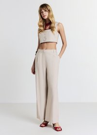 Calliope PALAZZO - Pantaloni - sabbia medio