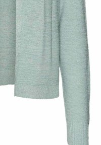 Maglione a maglia verde chiaro con una vestibilità comoda, polsini a coste e un motivo texture su tutto il tessuto.