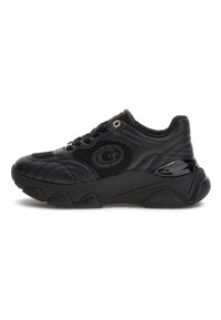 Black chunky sneaker with textured leather and mesh panels, rounded toe, thick sole, and metallic logo detail on side and laces.