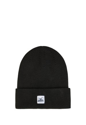 Schwarze gestrickte Beanie mit umgeschlagenem Bündchen, das ein kleines weißes rechteckiges Logo-Patch mit Text und Vogelmotiv zeigt.