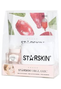 Ensemble de soins STARSKIN comprenant un bandeau blanc, du pudding de cactus rose dans un pot transparent, et une capsule de sérum, le tout dans une boîte transparente.