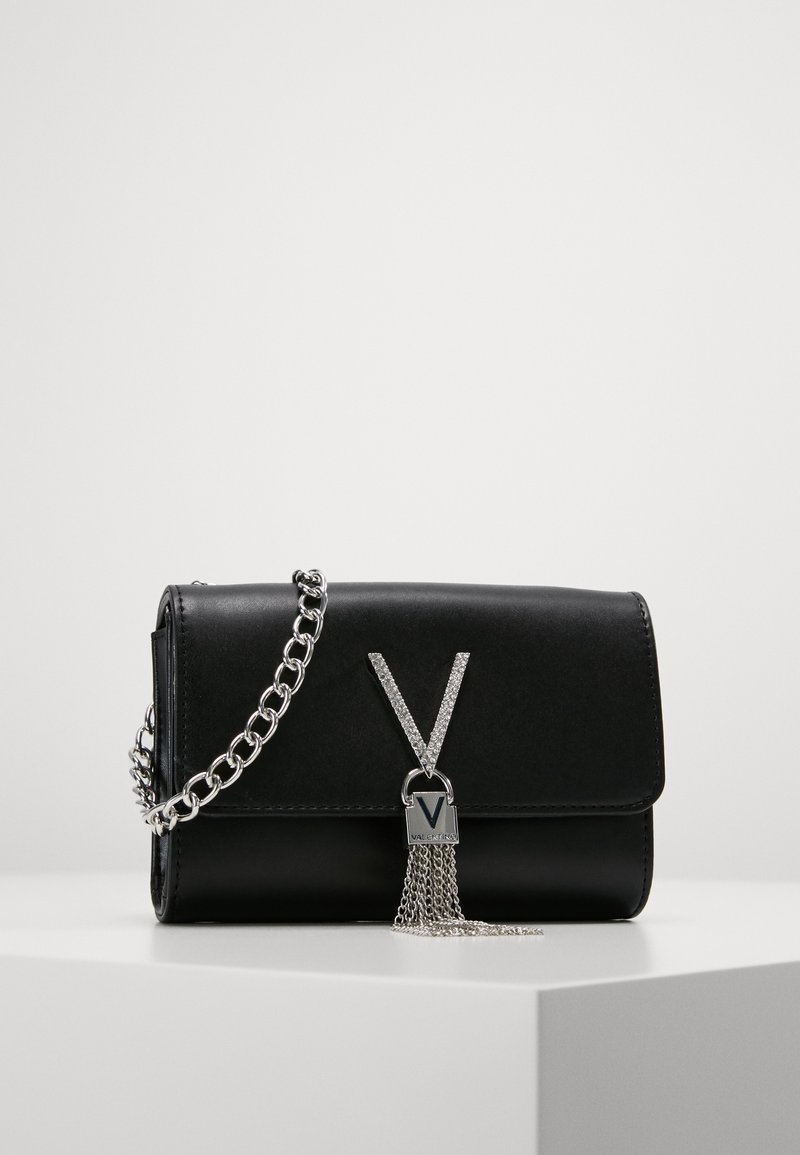 Black leather handbag with a silver chain strap, featuring a V-shaped metallic accent and a lock with a silver chain detail.