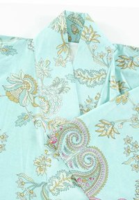 Turquoise kimono featuring floral and paisley patterns in gold, pink, and green. Lightweight fabric with a smooth texture and wide sleeves.