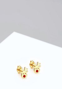 Orecchini a bottone a forma di renna dorati con naso di strass rosso, caratterizzati da ritagli del viso e delle corna. Finitura liscia e forma compatta.