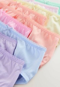 Rows of pastel-colored cotton women's underwear with lace trim and small decorative bows on the waistbands.