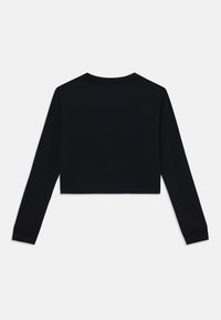Chemise noire courte à manches longues avec un col rond et des poignets côtelés. Fabriquée en tissu lisse, présentant un design épuré et minimaliste.