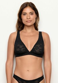 Zwarte kanten bralette met een V-hals ontwerp, brede schouderbanden en een bloemenpatroon. Zachte textuur, niet gevoerd met een lichte afwerking.